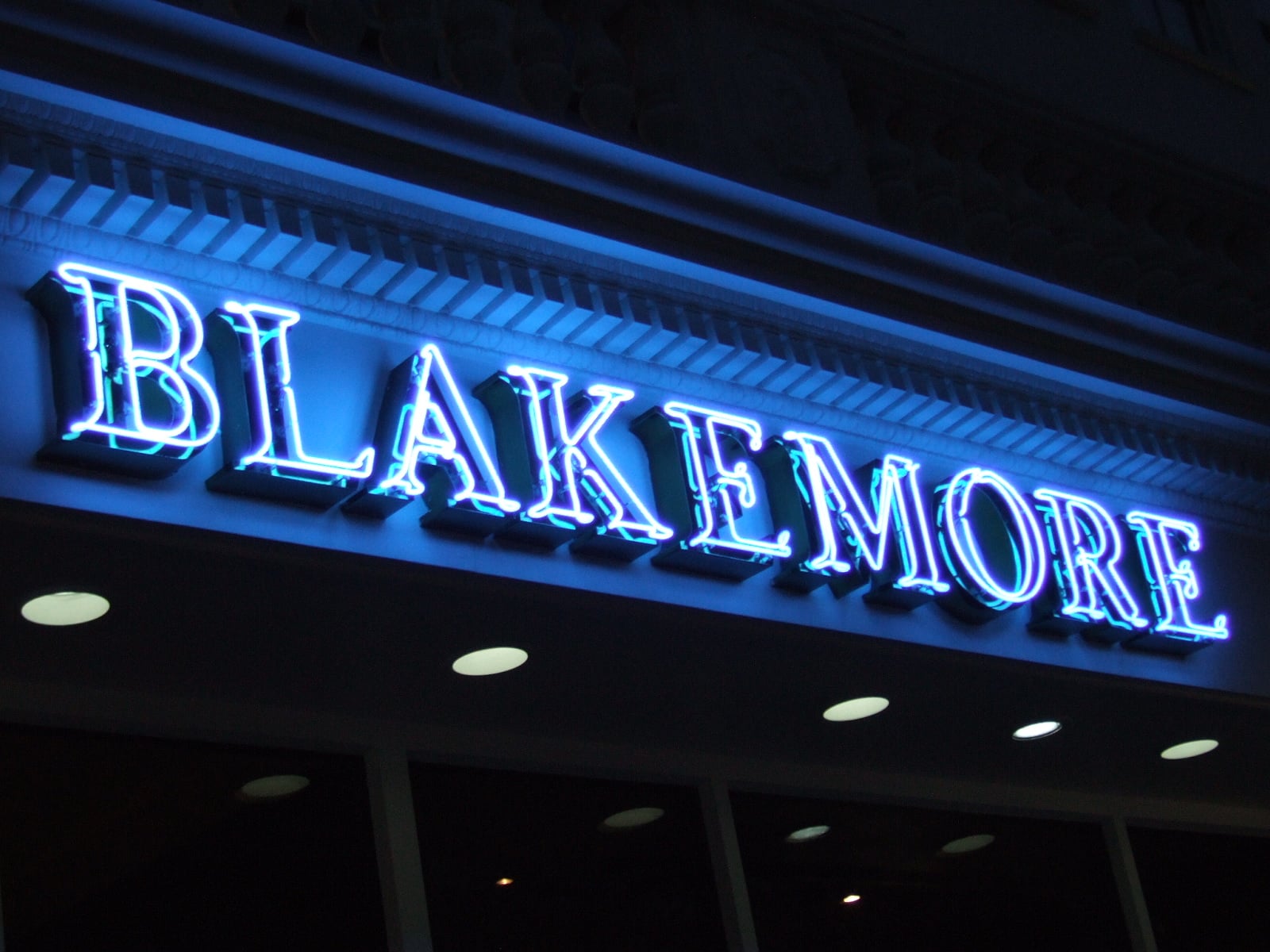 Neon Signs - Hero blue awning on high street shop