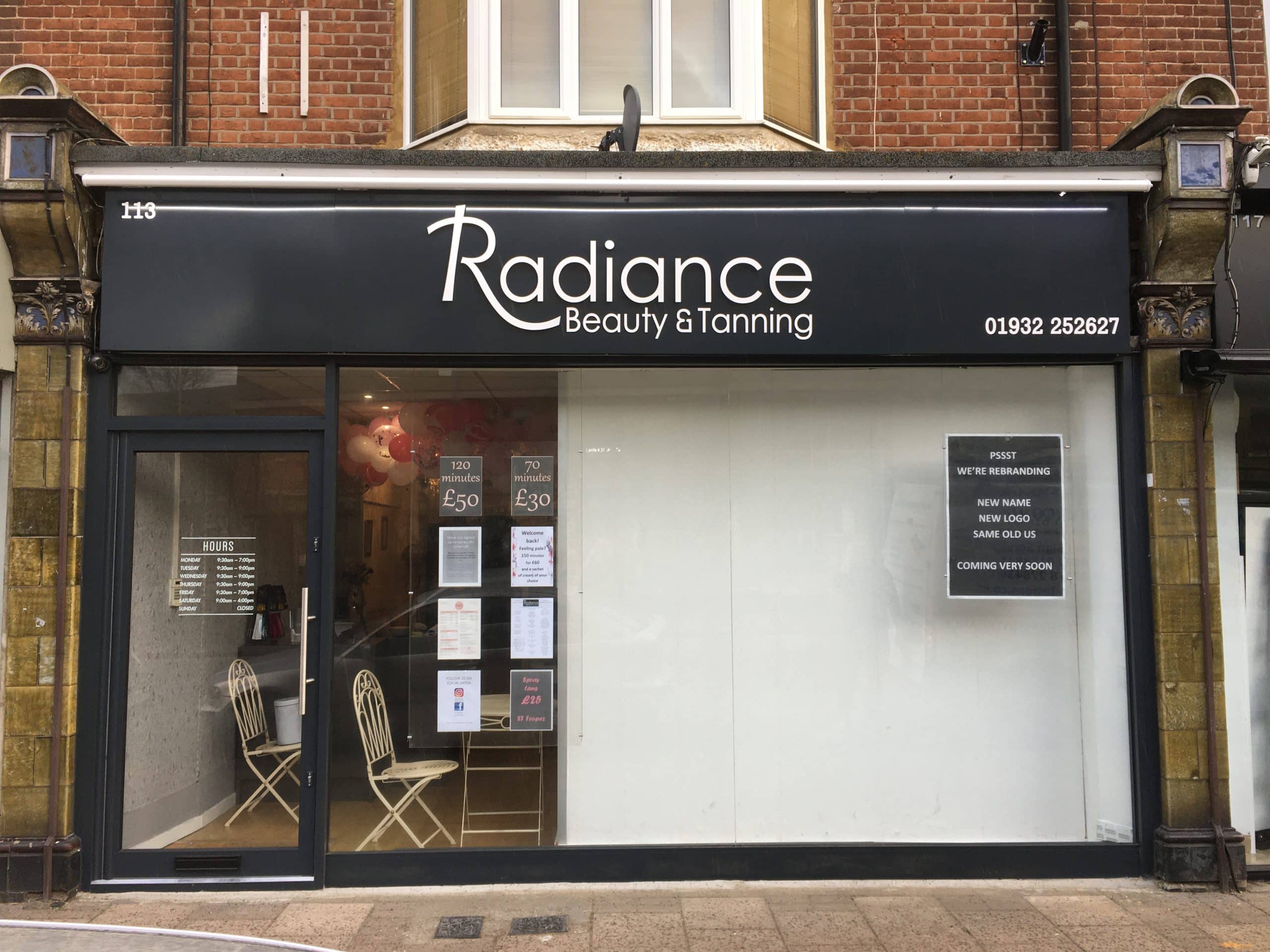Shop Front Signage & Security Grills - Hero blue awning on high street shop